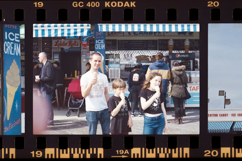 a film strip with a group of people walking around