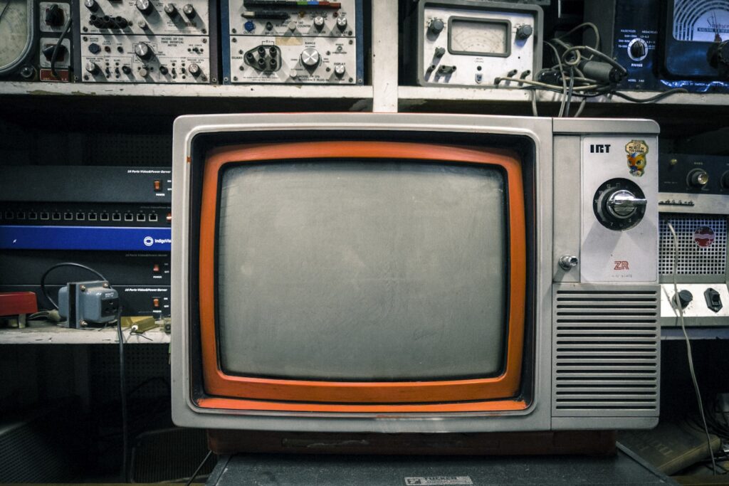 grey and orange CRT TV