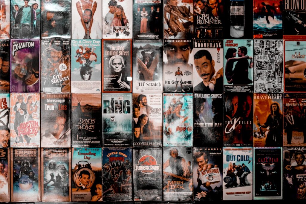 Movie cover wall section at PLAY Arcade